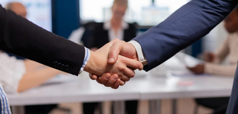 Satisfied businessman company employer wearing suit handshake new employee get hired at job interview, Man hr manager employ successful candidate shake hand at business meeting, placement concept